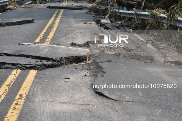 LOWER MAKEFIELD TOWNSHIP, PENNSYLVANIA, UNITED STATES - JULY 17 - Severe flooding damage and buckling roads in Lower Makefield Township, Pen...