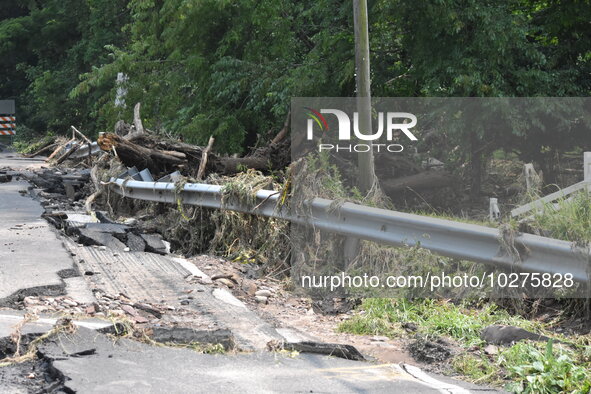 LOWER MAKEFIELD TOWNSHIP, PENNSYLVANIA, UNITED STATES - JULY 17 - Severe flooding damage and buckling roads in Lower Makefield Township, Pen...