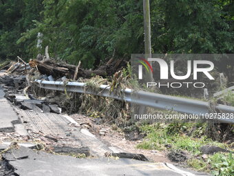 LOWER MAKEFIELD TOWNSHIP, PENNSYLVANIA, UNITED STATES - JULY 17 - Severe flooding damage and buckling roads in Lower Makefield Township, Pen...