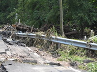 LOWER MAKEFIELD TOWNSHIP, PENNSYLVANIA, UNITED STATES - JULY 17 - Severe flooding damage and buckling roads in Lower Makefield Township, Pen...