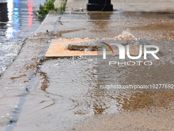 Flash flooding destroys homes, submerges cars and prompts water rescues in New Brunswick, New Jersey, United States on July 18, 2023. Flash...