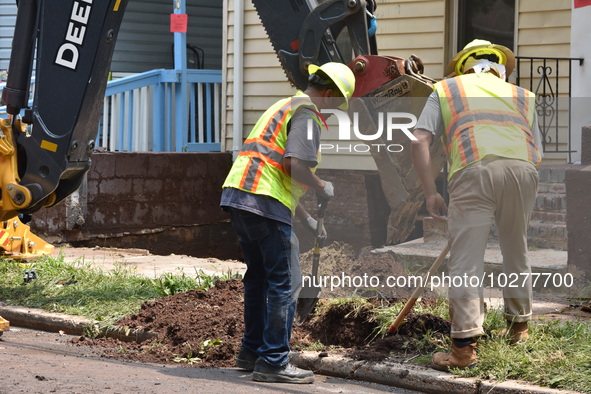 Flash flooding destroys homes, submerges cars and prompts water rescues in New Brunswick, New Jersey, United States on July 18, 2023. Flash...