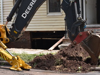 Flash flooding destroys homes, submerges cars and prompts water rescues in New Brunswick, New Jersey, United States on July 18, 2023. Flash...