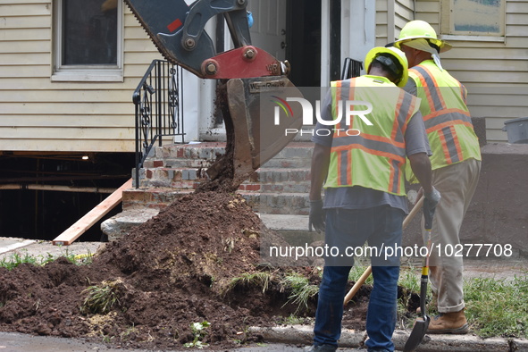 Flash flooding destroys homes, submerges cars and prompts water rescues in New Brunswick, New Jersey, United States on July 18, 2023. Flash...