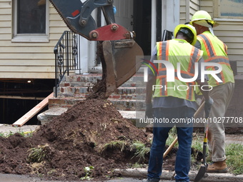 Flash flooding destroys homes, submerges cars and prompts water rescues in New Brunswick, New Jersey, United States on July 18, 2023. Flash...