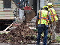 Flash flooding destroys homes, submerges cars and prompts water rescues in New Brunswick, New Jersey, United States on July 18, 2023. Flash...