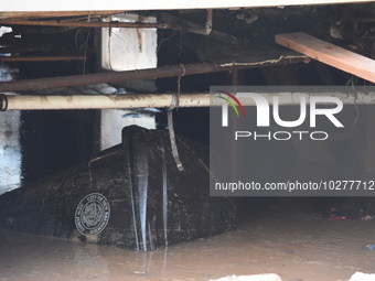 Flash flooding destroys homes, submerges cars and prompts water rescues in New Brunswick, New Jersey, United States on July 18, 2023. Flash...