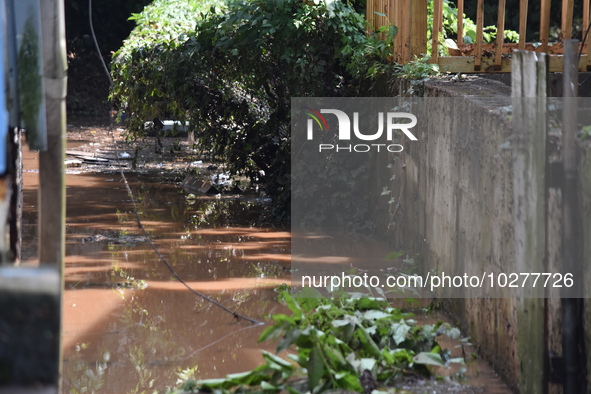 Flash flooding destroys homes, submerges cars and prompts water rescues in New Brunswick, New Jersey, United States on July 18, 2023. Flash...