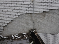 

Tiles are falling off the exterior wall of a high-rise residential building in Yichang, Hubei province, China, on July 19, 2023. With the...