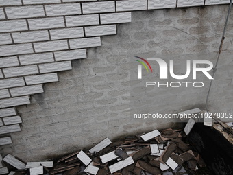 

Tiles are falling off the exterior wall of a high-rise residential building in Yichang, Hubei province, China, on July 19, 2023. With the...