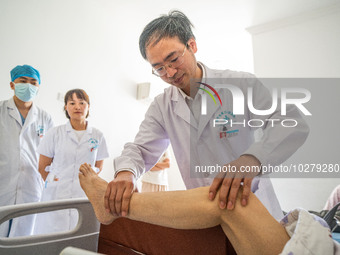 Medical staff check the recovery of a patient at the Third People's Hospital in Bijie, Southwest China's Guizhou province, July 13, 2023. (