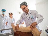 Medical staff check the recovery of a patient at the Third People's Hospital in Bijie, Southwest China's Guizhou province, July 13, 2023. (