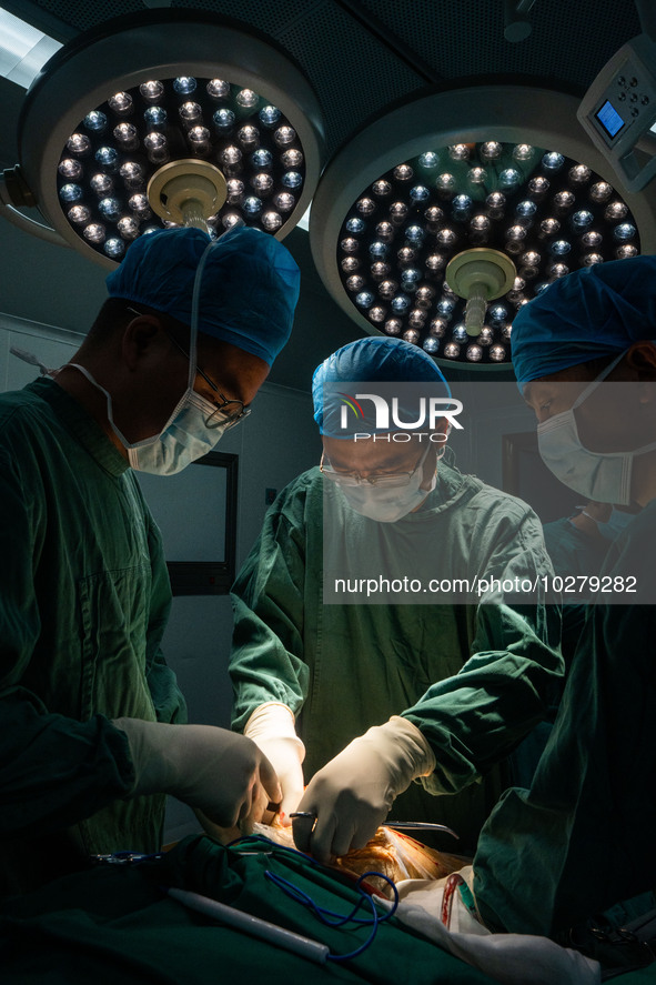 Medical staff perform orthopedic surgery on a patient at the Third People's Hospital in Bijie, Southwest China's Guizhou province, July 13,...