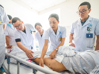 Medical staff discuss the treatment of femoral head necrosis at the First People's Hospital in Bijie, Southwest China's Guizhou province, Ju...