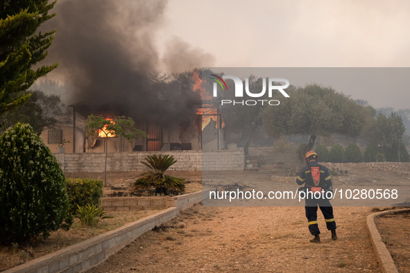 

A burned house in Nea Zoi, Nea Peramos, near Megara, Greece is still being fought by firefighters after three days on July 19, 2023. 