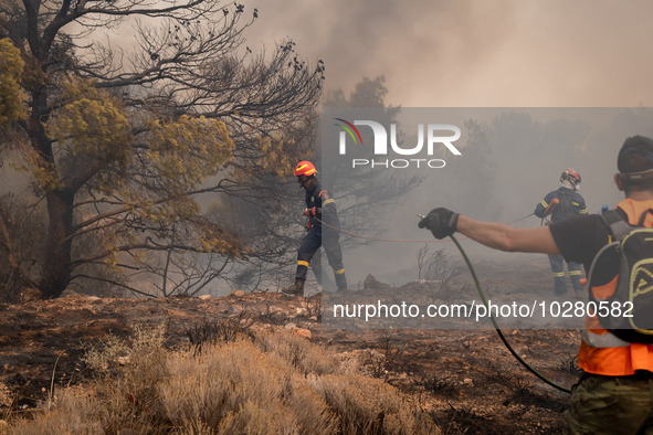 

Firefighters are trying to extinguish a wildfire in Nea Zoi, Nea Peramos, near Megara, Greece on July 19, 2023. After three days, firefigh...