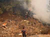 

Firefighters are trying to extinguish a wildfire in Nea Zoi, Nea Peramos, near Megara, Greece on July 19, 2023. After three days, firefigh...