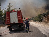 

Athens, Greece, on July 18th, 2023, Greek firefighters are trying to block the wildfire from its way from Dervenohoria to the forest of Pa...