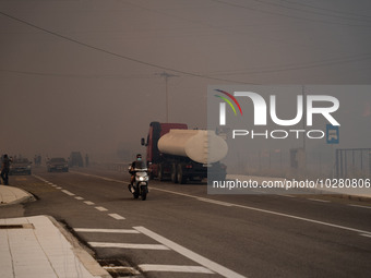 

Athens, Greece, on July 18th, 2023, a thick smoke cloud is hovering during the Dervenohoria wildfire. (