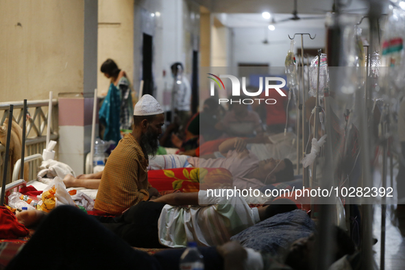 A man offers prayer as he suffering from dengue fever being treated at a government hospital in Dhaka, Bangladesh on July 20. 2023. More tha...