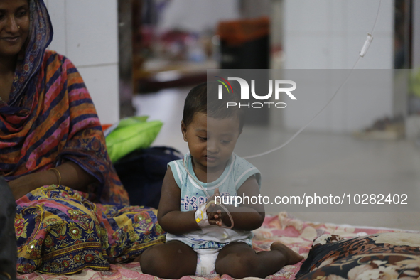 A child suffering from dengue fever being treated at a government hospital in Dhaka, Bangladesh on July 20. 2023. More than 100 people have...