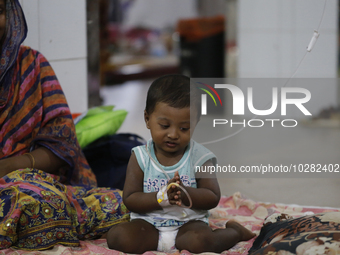 A child suffering from dengue fever being treated at a government hospital in Dhaka, Bangladesh on July 20. 2023. More than 100 people have...