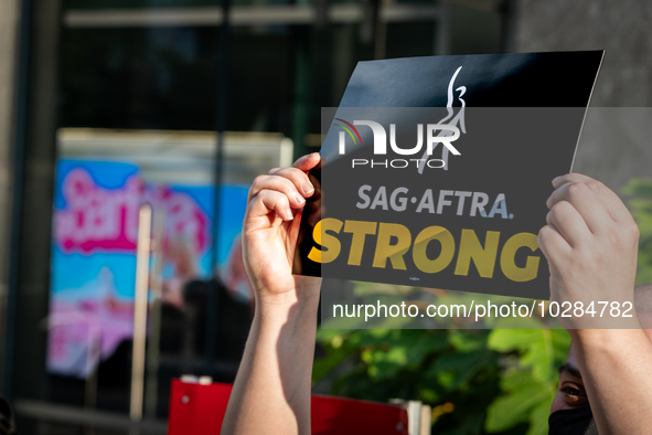 SAG-AFTRA actors and other union members picket a Barbie screening in Washington, DC.  Actors began their strike July 14, 2023, after contra...