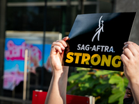 SAG-AFTRA actors and other union members picket a Barbie screening in Washington, DC.  Actors began their strike July 14, 2023, after contra...