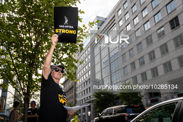 Rick Kain of the Mid-Atlantic chapter of SAG-AFTRA,  actors, and other union members picket a Barbie screening in Washington, DC.  Actors be...