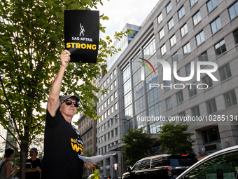 Rick Kain of the Mid-Atlantic chapter of SAG-AFTRA,  actors, and other union members picket a Barbie screening in Washington, DC.  Actors be...