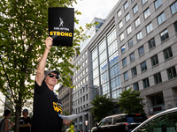 Rick Kain of the Mid-Atlantic chapter of SAG-AFTRA,  actors, and other union members picket a Barbie screening in Washington, DC.  Actors be...