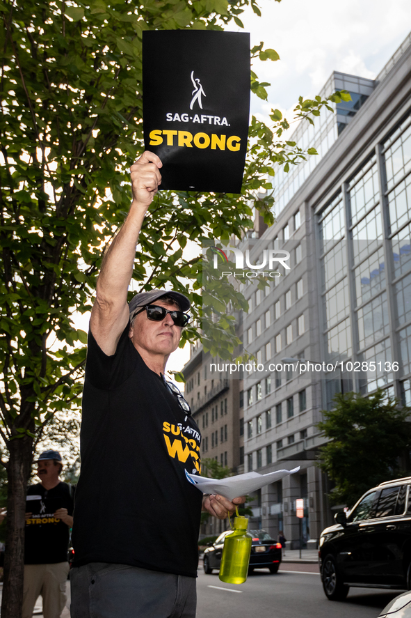 Rick Kain of the Mid-Atlantic chapter of SAG-AFTRA,  actors, and other union members picket a Barbie screening in Washington, DC.  Actors be...