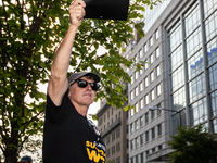 Rick Kain of the Mid-Atlantic chapter of SAG-AFTRA,  actors, and other union members picket a Barbie screening in Washington, DC.  Actors be...