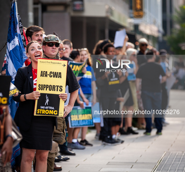 SAG-AFTRA actors and other union members picket a Barbie screening in Washington, DC.  Actors began their strike July 14, 2023, after contra...