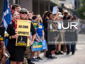 SAG-AFTRA actors and other union members picket a Barbie screening in Washington, DC.  Actors began their strike July 14, 2023, after contra...