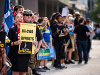 SAG-AFTRA actors and other union members picket a Barbie screening in Washington, DC.  Actors began their strike July 14, 2023, after contra...