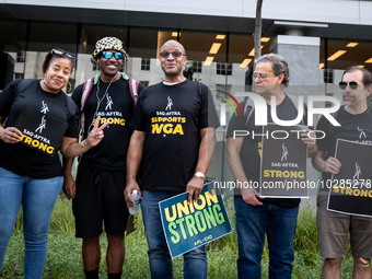 SAG-AFTRA actors and other union members picket a Barbie screening in Washington, DC.  Actors began their strike July 14, 2023, after contra...