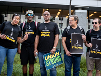 SAG-AFTRA actors and other union members picket a Barbie screening in Washington, DC.  Actors began their strike July 14, 2023, after contra...