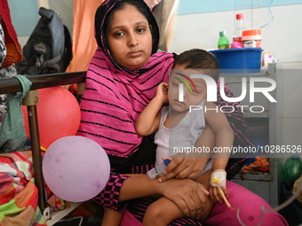 

Patients suffering from dengue fever are being treated inside the Mugdha General Hospital's admission section in Dhaka, Bangladesh on July...