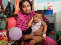 

Patients suffering from dengue fever are being treated inside the Mugdha General Hospital's admission section in Dhaka, Bangladesh on July...