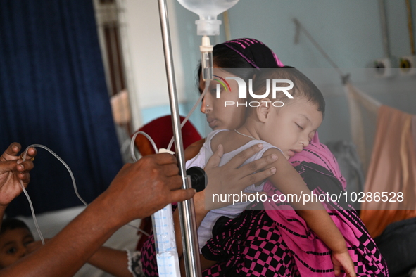 

Patients suffering from dengue fever are being treated inside the Mugdha General Hospital's admission section in Dhaka, Bangladesh on July...