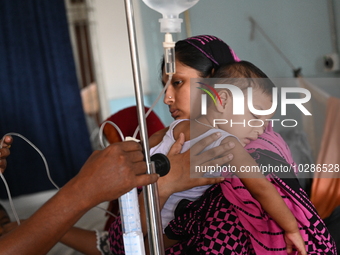 

Patients suffering from dengue fever are being treated inside the Mugdha General Hospital's admission section in Dhaka, Bangladesh on July...