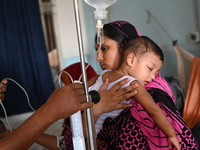 

Patients suffering from dengue fever are being treated inside the Mugdha General Hospital's admission section in Dhaka, Bangladesh on July...