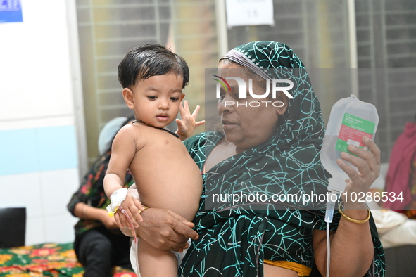 

Patients suffering from dengue fever are being treated inside the Mugdha General Hospital's admission section in Dhaka, Bangladesh on July...