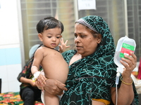 

Patients suffering from dengue fever are being treated inside the Mugdha General Hospital's admission section in Dhaka, Bangladesh on July...