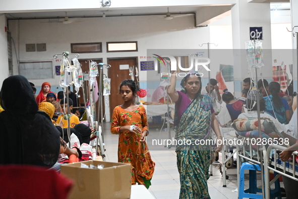 

Patients suffering from dengue fever are being treated inside the Mugdha General Hospital's admission section in Dhaka, Bangladesh on July...