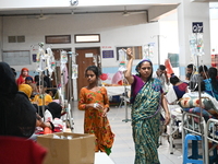 

Patients suffering from dengue fever are being treated inside the Mugdha General Hospital's admission section in Dhaka, Bangladesh on July...