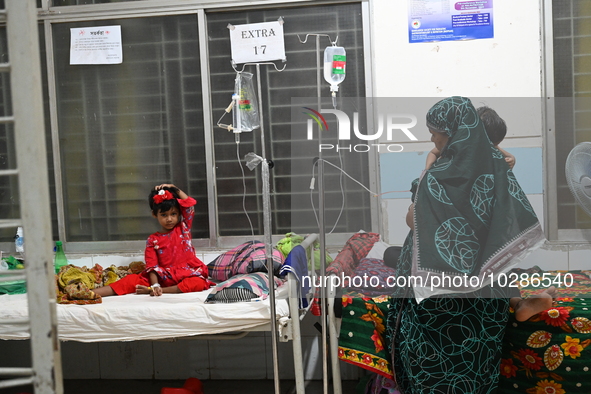 

Patients suffering from dengue fever are being treated inside the Mugdha General Hospital's admission section in Dhaka, Bangladesh on July...