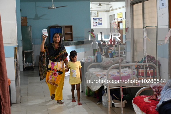 

Patients suffering from dengue fever are being treated inside the Mugdha General Hospital's admission section in Dhaka, Bangladesh on July...