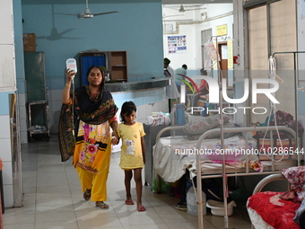 

Patients suffering from dengue fever are being treated inside the Mugdha General Hospital's admission section in Dhaka, Bangladesh on July...